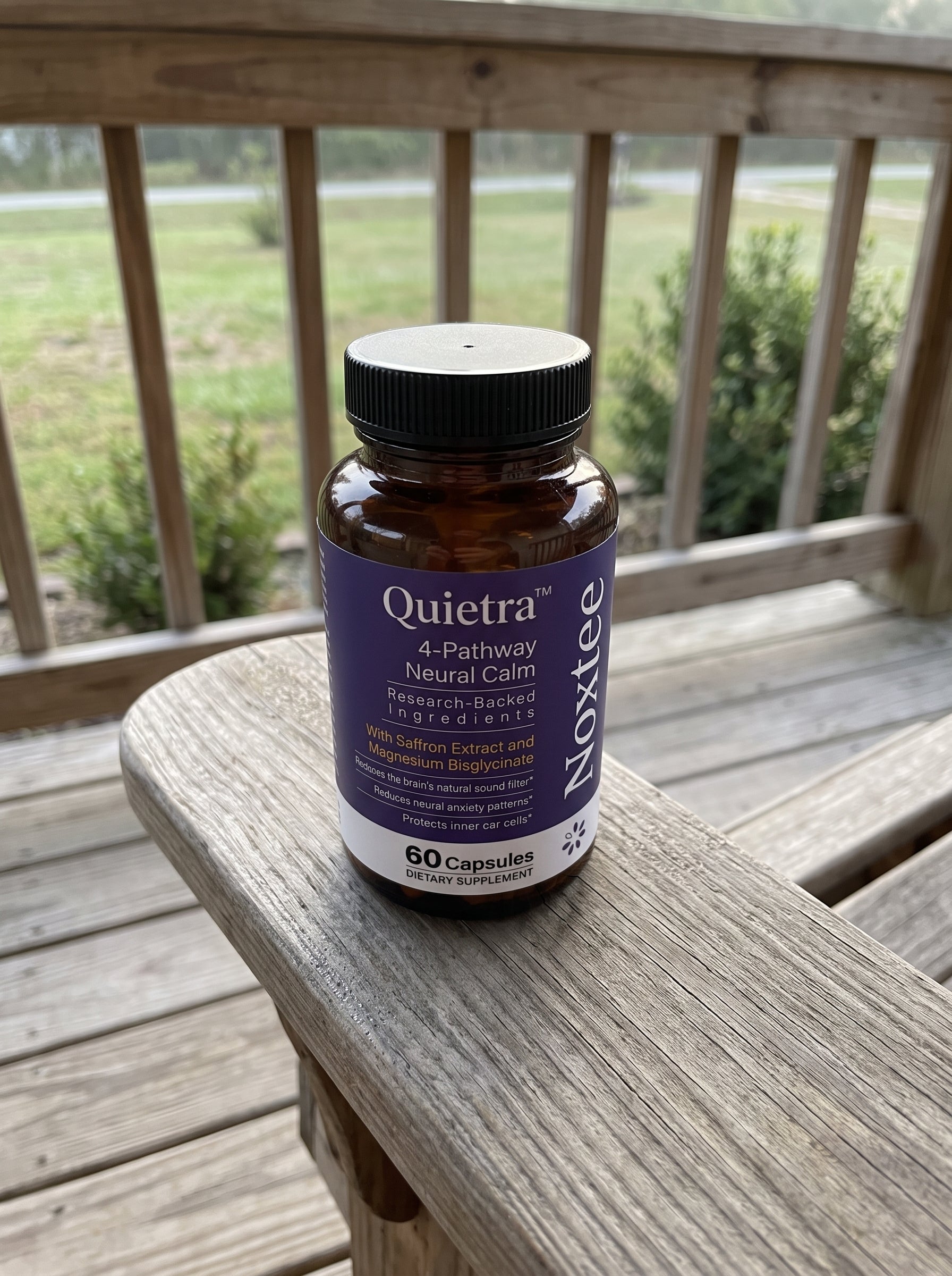 Noxtee bottle on a quiet porch chair in the morning