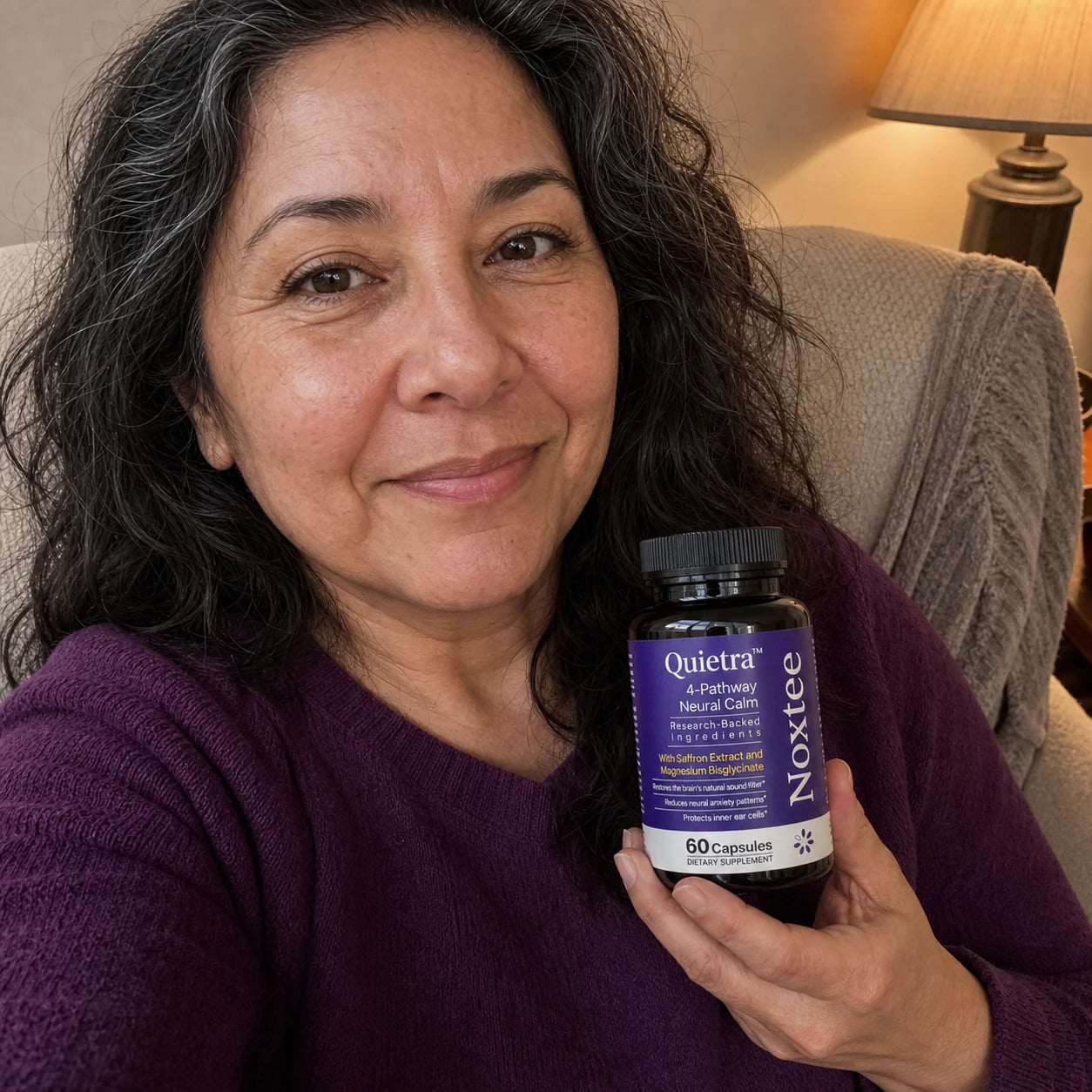 Tracy holding a Noxtee bottle
