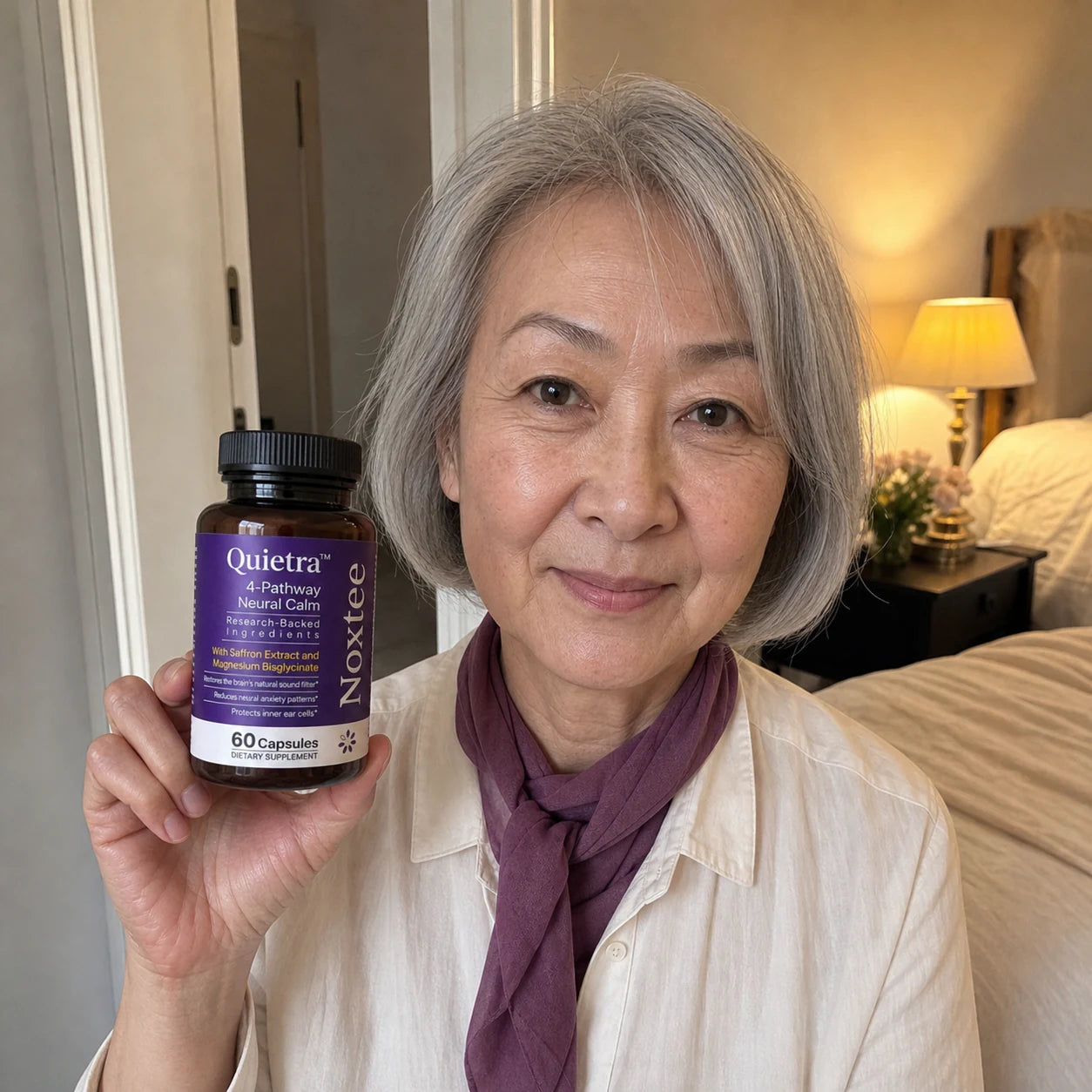 Woman holding a Noxtee bottle