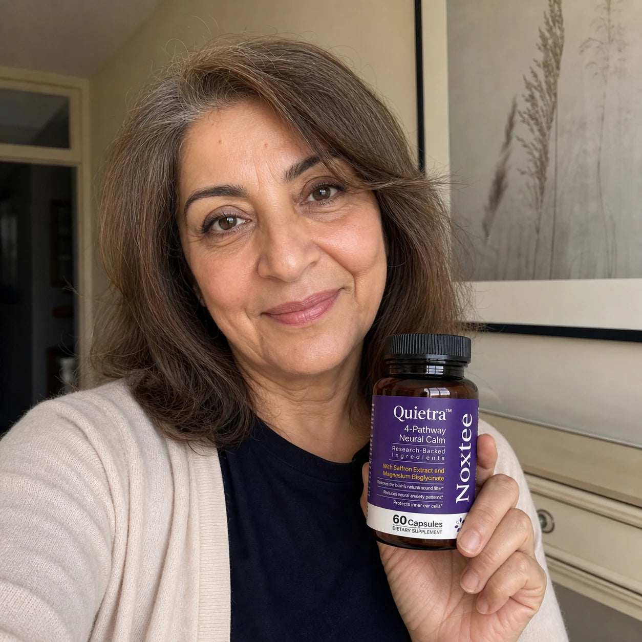 Tammy holding a Noxtee bottle