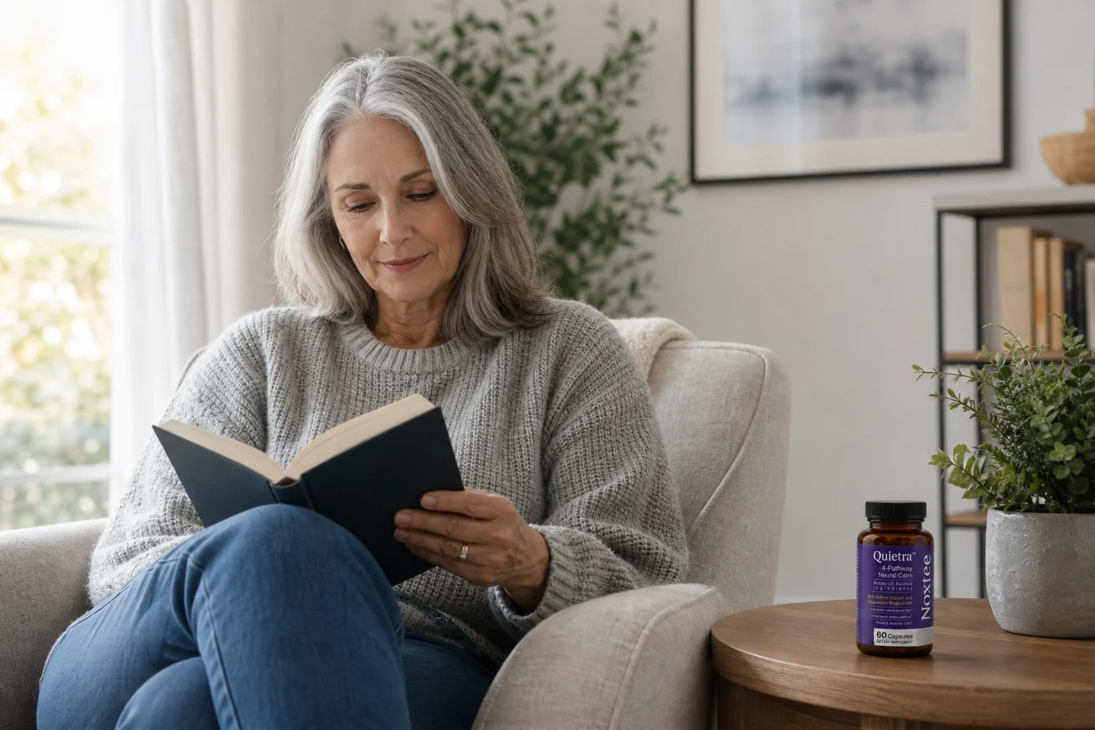 Woman calmly reading with Quietra nearby