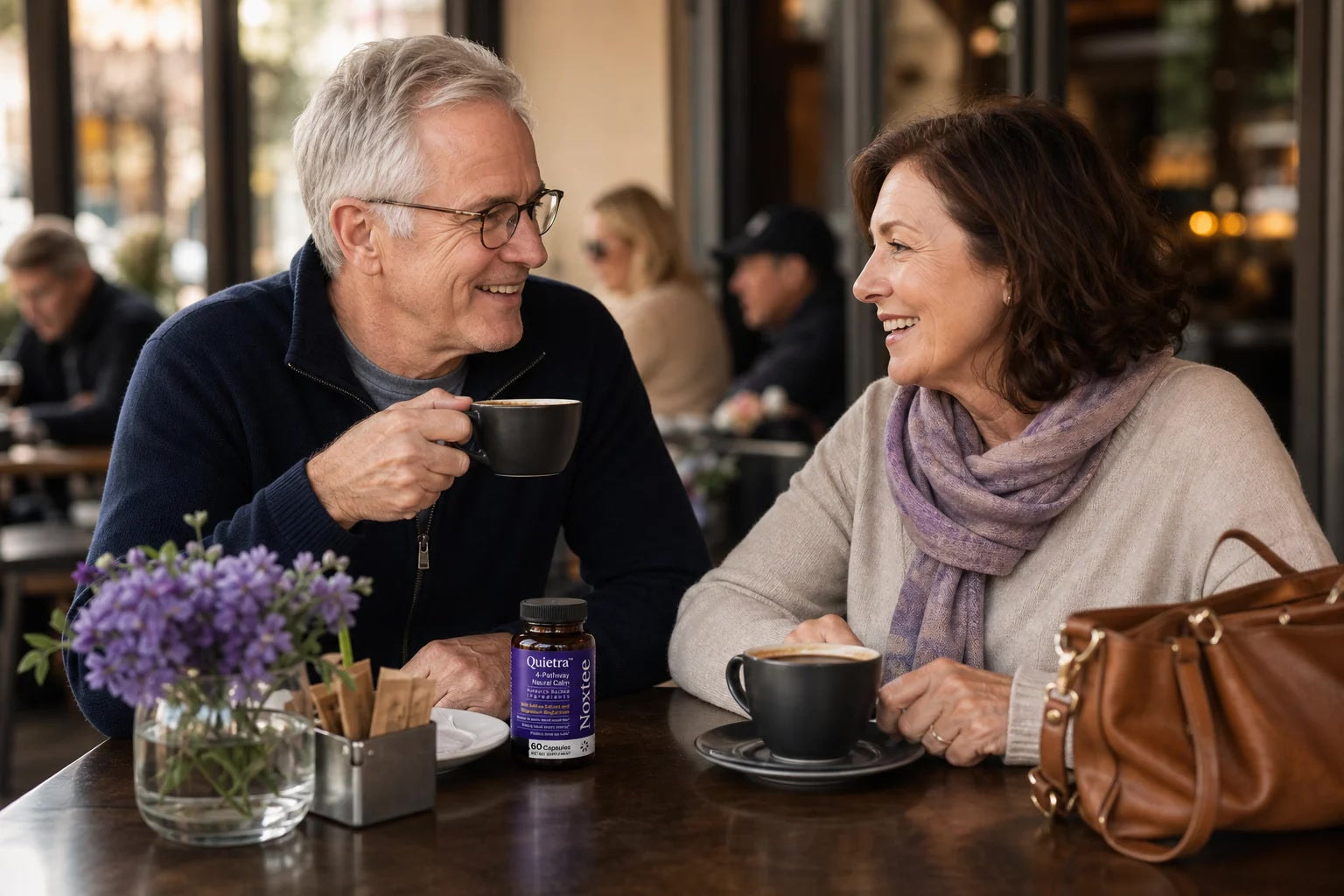 Older couple enjoying a relaxed conversation at a cafe